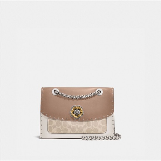 Coach parker with online rivets and snakeskin detail